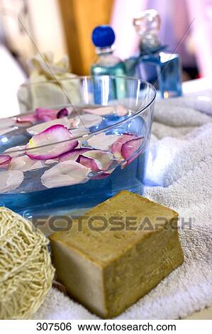 Olive soap with loofah and perfume bottles View Large Photo Image Stock Photograph - Olive soap with loofah and perfume bottles . Fotosearch