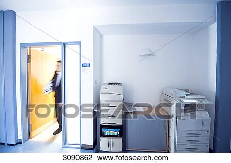 Overworked businessman entering a room, blurred motion View Large Photo Image Stock Image - Overworked businessman entering a room, blurred motion . Fotosearch