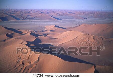 Panoramic view of sand dunes in desert, Sossusvlei, Namib Desert, Namibia View Large Photo Image Picture - Panoramic view of sand dunes in desert, Sossusvlei, Namib Desert, Namibia . Fotosearch