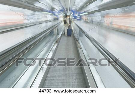 Passenger moving with luggage in airport, Frankfurt, Germany, Europe View Large Photo Image Stock Image - Passenger moving with luggage in airport, Frankfurt, Germany, Europe . Fotosearch