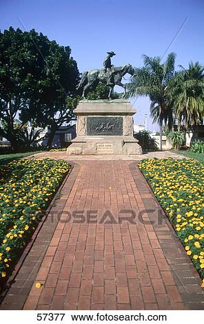 Stock Photo - Path leading to a statue on a pedestal, Dick King Statue, Kwazulu-Natal, Durban, South Africa . Fotosearch