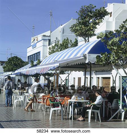Picture - People at sidewalk cafe, Port of Las Nieves, Gran Canaria, Canary Islands, Spain . Fotosearch