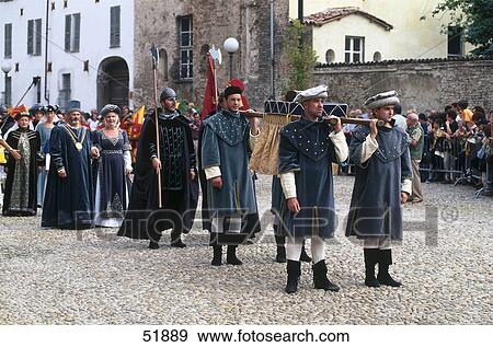 Stock Photo - People in costumes during festival, Asti, Piedmont, Italy . Fotosearch