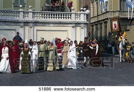 Stock Photograph - People in costumes during festival, Asti, Piedmont, Italy . Fotosearch
