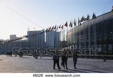 Stock Photograph - People moving in front of buildings, Park of Nations, Lisbon, Portugal . Fotosearch