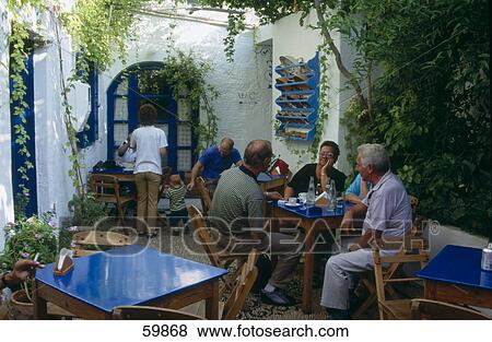 People sitting at cafe, Rhodes, Dodecanese Islands, Greece View Large Photo Image Stock Photo - People sitting at cafe, Rhodes, Dodecanese Islands, Greece . Fotosearch