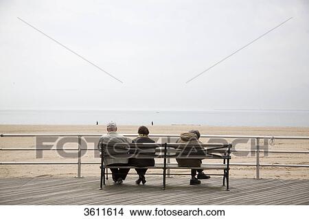 Picture - People sitting on a bench, New York City, New York State, USA, America . Fotosearch