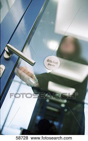 Stock Photo - Person opening door . Fotosearch