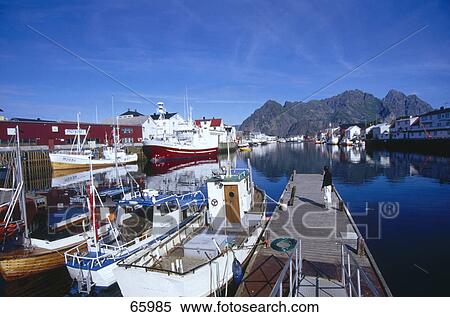 Person standing on a pier at the port, Fjords, Henningsvaer, Lofoten Islands, Norway View Large Photo Image Stock Photography - Person standing on a pier at the port, Fjords, Henningsvaer, Lofoten Islands, Norway . Fotosearch