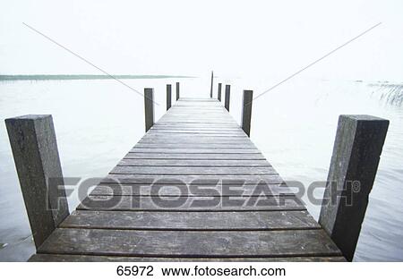 Stock Image - Pier in sea . Fotosearch