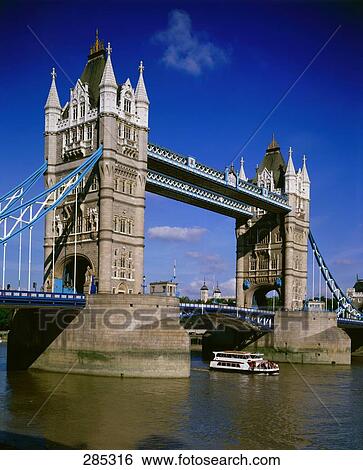Stock Photograph - Pleasure boat in river, Tower Bridge, Thames River, London, England . Fotosearch