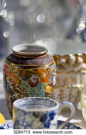 Porcelain tea cup and flower vase, close-up View Large Photo Image Stock Image - Porcelain tea cup and flower vase, close-up . Fotosearch