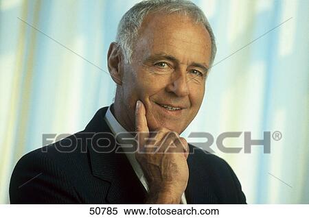 Stock Photography - Portrait of businessman smiling . Fotosearch