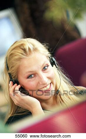 Portrait of businesswoman talking on headset View Large Photo Image Stock Image - Portrait of businesswoman talking on headset . Fotosearch