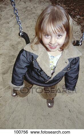 Portrait of girl near swing View Large Photo Image Stock Photograph - Portrait of girl near swing . Fotosearch