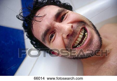 Portrait of man laughing in bathtub View Large Photo Image Picture - Portrait of man laughing in bathtub . Fotosearch