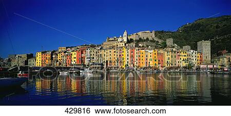 Stock Photograph - Reflection of buildings in water, Portovenere, Liguria, Italy . Fotosearch