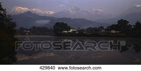 Reflection of mountain range in lake, Annapurna Range, Himalayas, Lake Phewa, Pokhara, Nepal View Large Photo Image Stock Image - Reflection of mountain range in lake, Annapurna Range, Himalayas, Lake Phewa, Pokhara, Nepal . Fotosearch