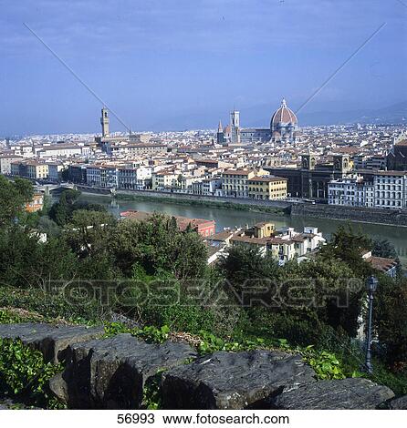 Stock Image - River flowing through city, Piazza Michelangelo, River Arno, Florence, Tuscany, Italy . Fotosearch