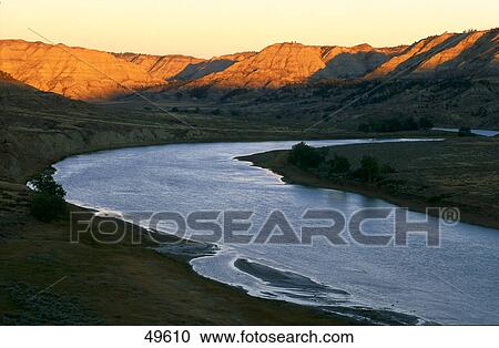 Stock Image - River with mountains at dusk, Upper Missouri River Breaks National Monument, Missouri River, Montana, USA . Fotosearch