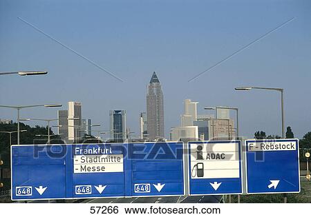 Stock Photograph - Road sign with skyscrapers in background, Bundesautobahn 643, Frankfurt, Hesse, Germany . Fotosearch