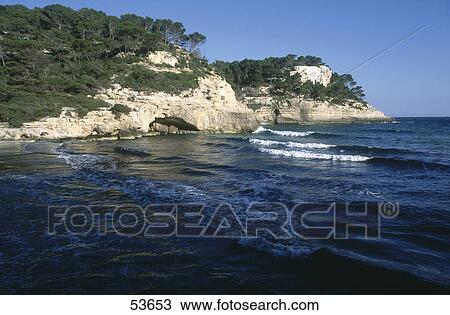 Stock Image - Rock formations on coast, Cala Mitjana, Minorca, Balearic Islands, Spain . Fotosearch
