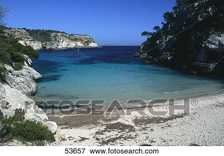 Stock Photo - Rock formations on coast, Cala Macarelleta, Minorca, Balearic Islands, Spain . Fotosearch