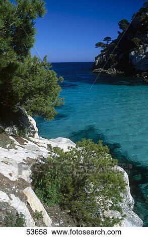 Stock Photo - Rock formations on coast, Cala Macarelleta, Minorca, Balearic Islands, Spain . Fotosearch