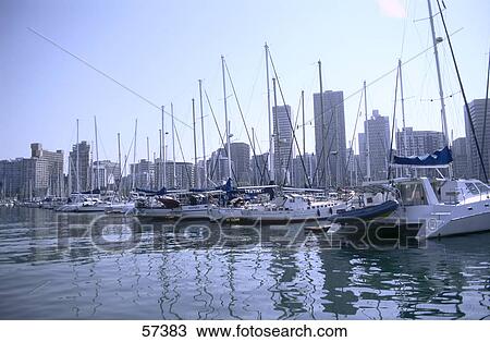 Stock Image - Sailboats moored at harbor, Durban, Kwazulu-Natal, South Africa . Fotosearch