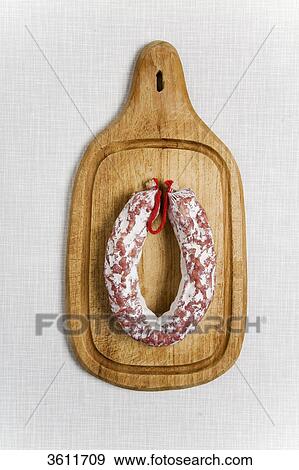 Stock Photo - Salami on a slat . Fotosearch