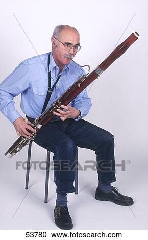 Senior man playing bassoon View Large Photo Image Stock Image - Senior man playing bassoon . Fotosearch