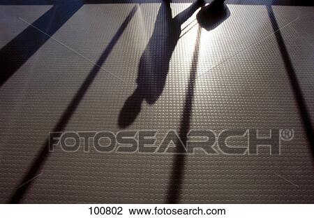 Stock Image - Shadow of businessman on floor . Fotosearch