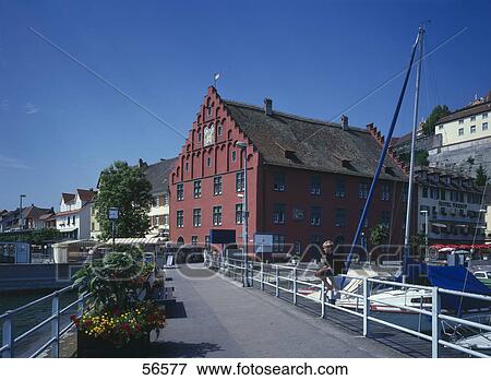 Stock Photo - Side profile of boy sitting on railing, Germany, Europe . Fotosearch