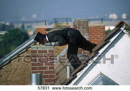 Side profile of man cleaning chimney View Large Photo Image Stock Image - Side profile of man cleaning chimney . Fotosearch