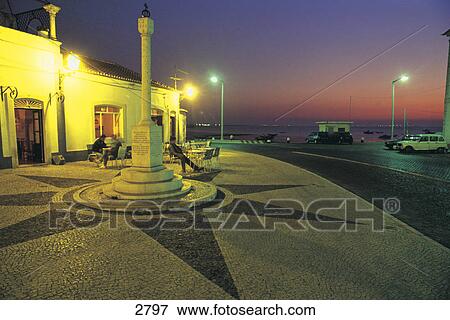 Sidewalk cafe at dusk, Alcochete, Tagus River, Lisbon, Portugal View Large Photo Image Stock Photo - Sidewalk cafe at dusk, Alcochete, Tagus River, Lisbon, Portugal . Fotosearch