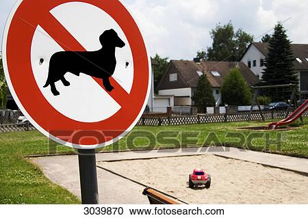 Sign dogs forbidden in front of a playground View Large Photo Image Stock Image - Sign dogs forbidden in front of a playground . Fotosearch
