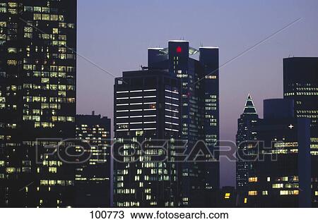 Skyscrapers lit up at evening, Frankfurt, Hesse, Germany View Large Photo Image Stock Image - Skyscrapers lit up at evening, Frankfurt, Hesse, Germany . Fotosearch