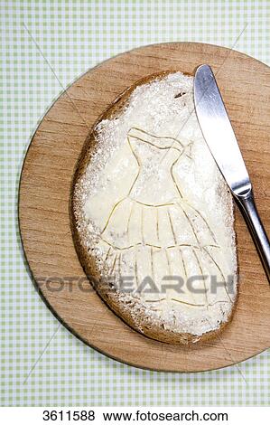 Stock Photo - Slice of bread with cream cheese on a slat . Fotosearch