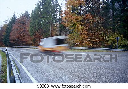 Stock Photo - Small truck in motion on country road . Fotosearch