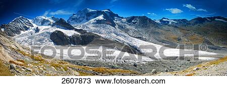 Stock Image - Snowcapped mountain range, Piz Bernina, Switzerland . Fotosearch
