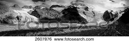 Stock Photograph - Snowcapped mountain range, Piz Palu, Morteratsch, Switzerland . Fotosearch