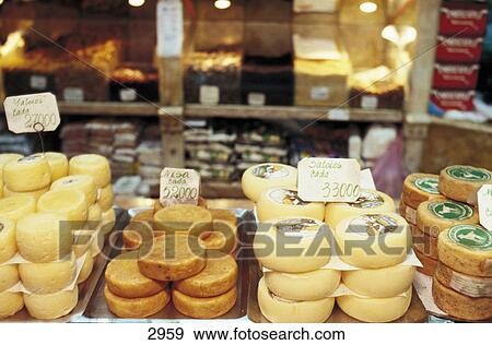 Stack of cheese wheels on sale in market, Baixa, Lisbon, Portugal, Europe View Large Photo Image Stock Photo - Stack of cheese wheels on sale in market, Baixa, Lisbon, Portugal, Europe . Fotosearch