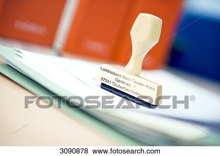 Stamp on a stack of paper, close-up View Large Photo Image Stock Photo - Stamp on a stack of paper, close-up . Fotosearch