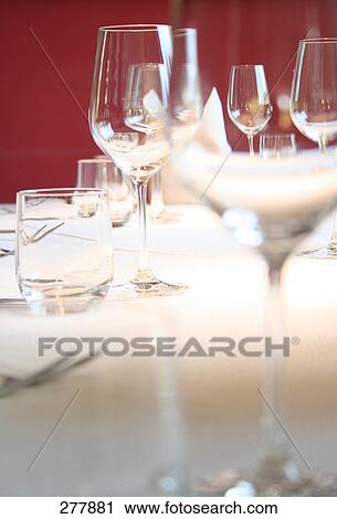 Stem glasses on table View Large Photo Image Stock Image - Stem glasses on table . Fotosearch