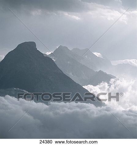 Storm clouds over mountain range, Karwendel, Germany View Large Photo Image Stock Image - Storm clouds over mountain range, Karwendel, Germany . Fotosearch