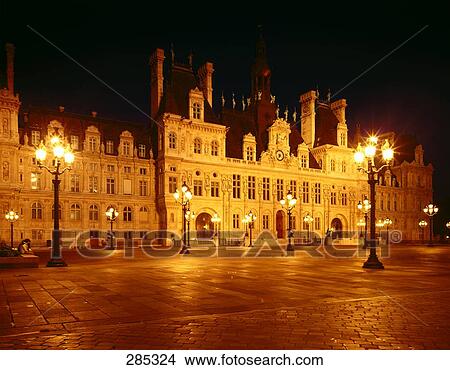 Street lights lit up in front of hotel View Large Photo Image Picture - Street lights lit up in front of hotel . Fotosearch