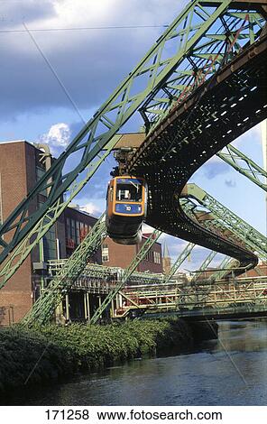 Stock Photo - Suspension monorail over river, Wuppertal Schwebebahn, River Wupper, Wuppertal, North Rhine Westphalia, Germany . Fotosearch