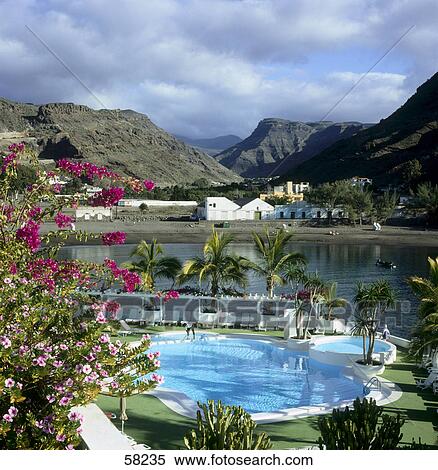 Stock Photography - Swimming pool in a resort, Puerto de Mogan, Gran Canaria, Canary Islands, Spain . Fotosearch