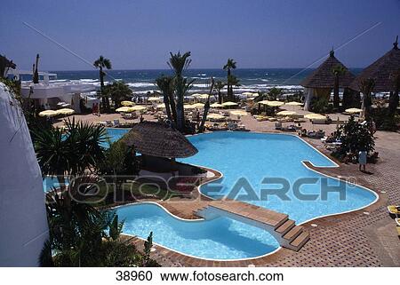 Stock Image - Swimming pool in hotel, Marbella, Malaga Province, Andalusia, Spain . Fotosearch