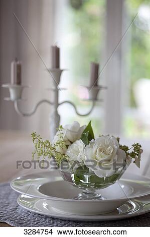 Picture - Table decoration with candleholder and white roses, Ramsen, Switzerland, close-up . Fotosearch